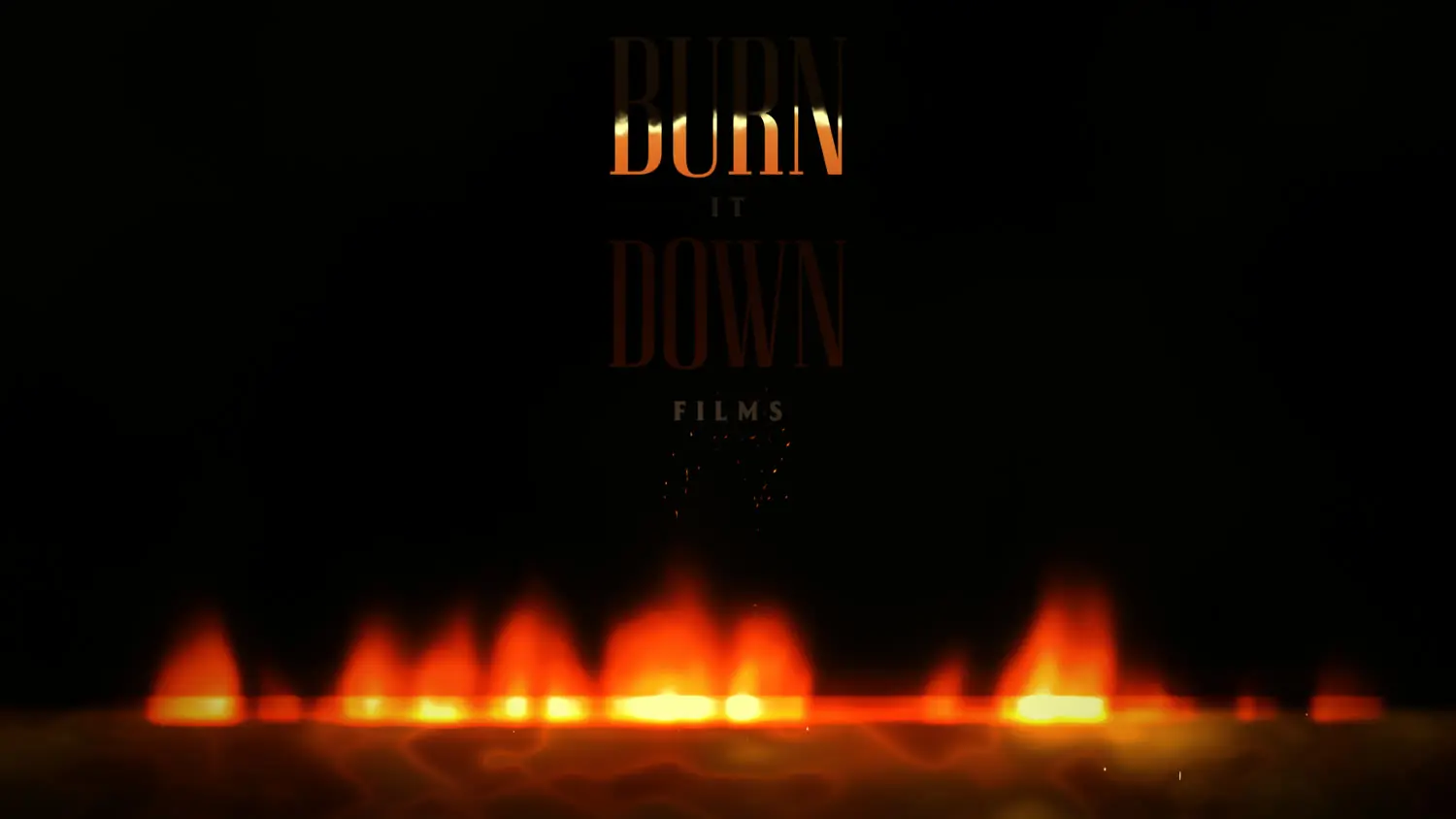 BURN forms out of the fire while the rest of the logo waits in the firelight