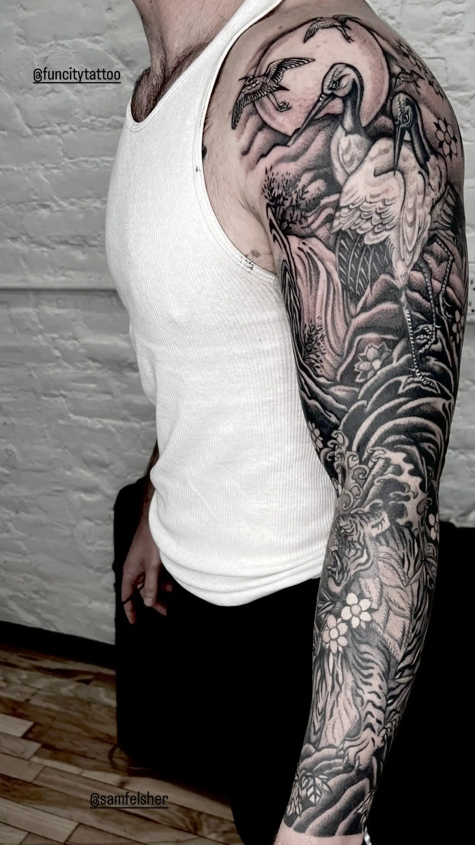 Blackwork heron sleeve by a Fun City Tattoo artist
