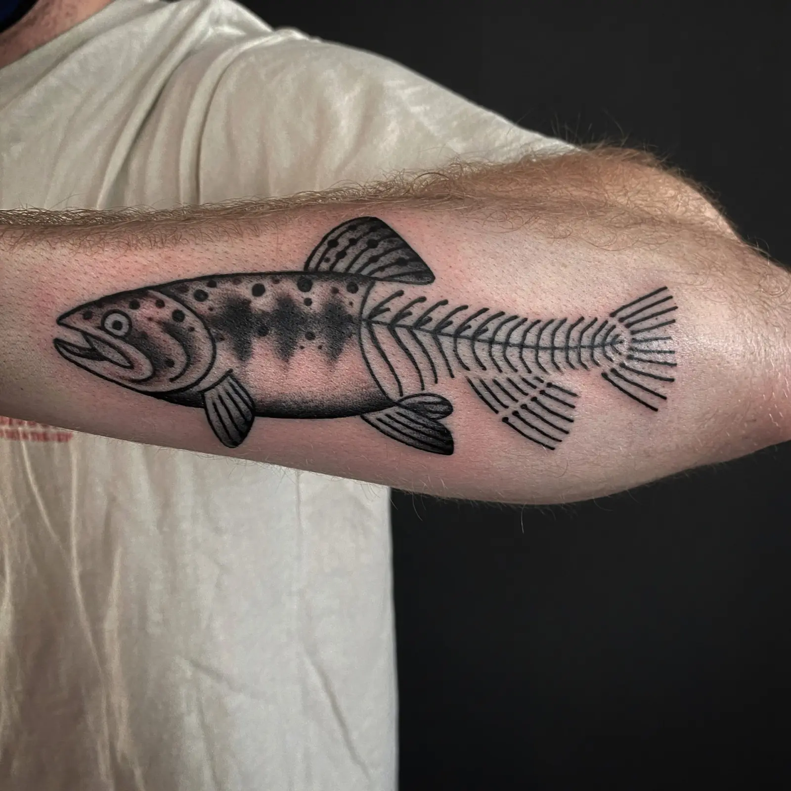 Blackwork trout tattoo by a Fun City Tattoo artist