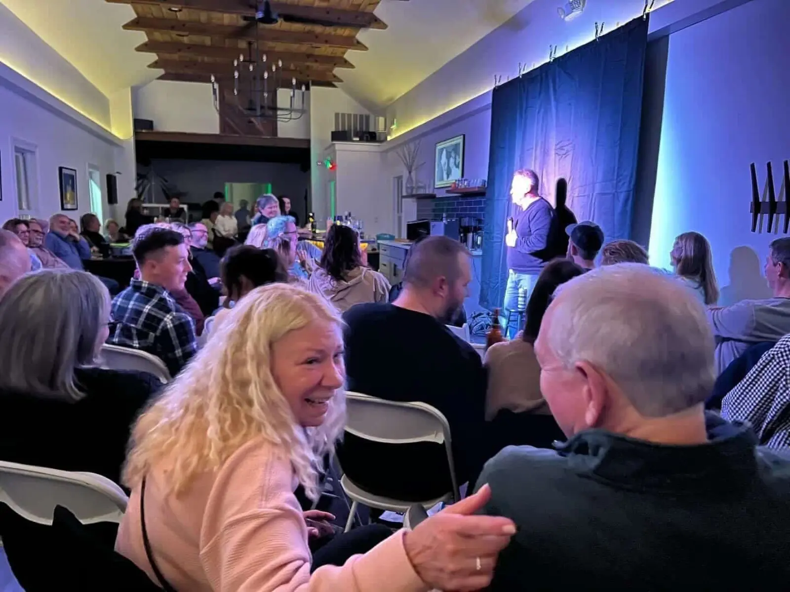 A packed comedy night under Peak Party Rentals production